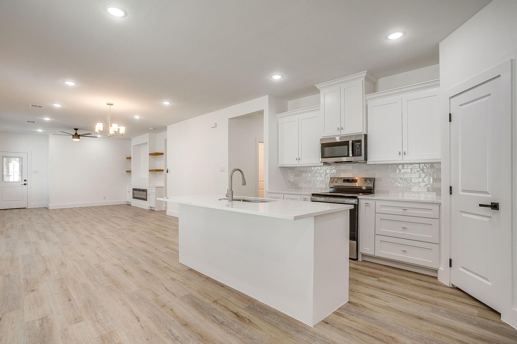 Dunbar Residence — open-concept kitchen and living area with island