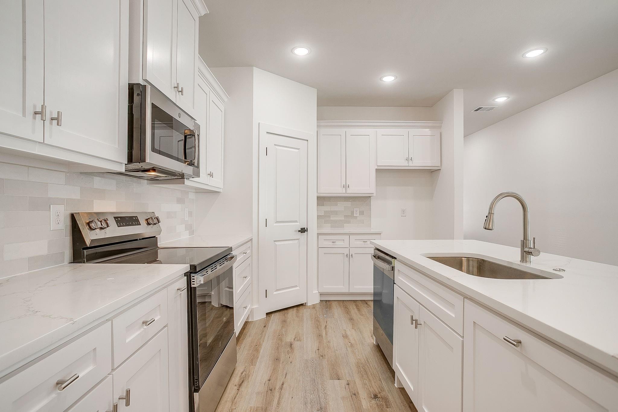 Dunbar Residence — kitchen detail with range and sink