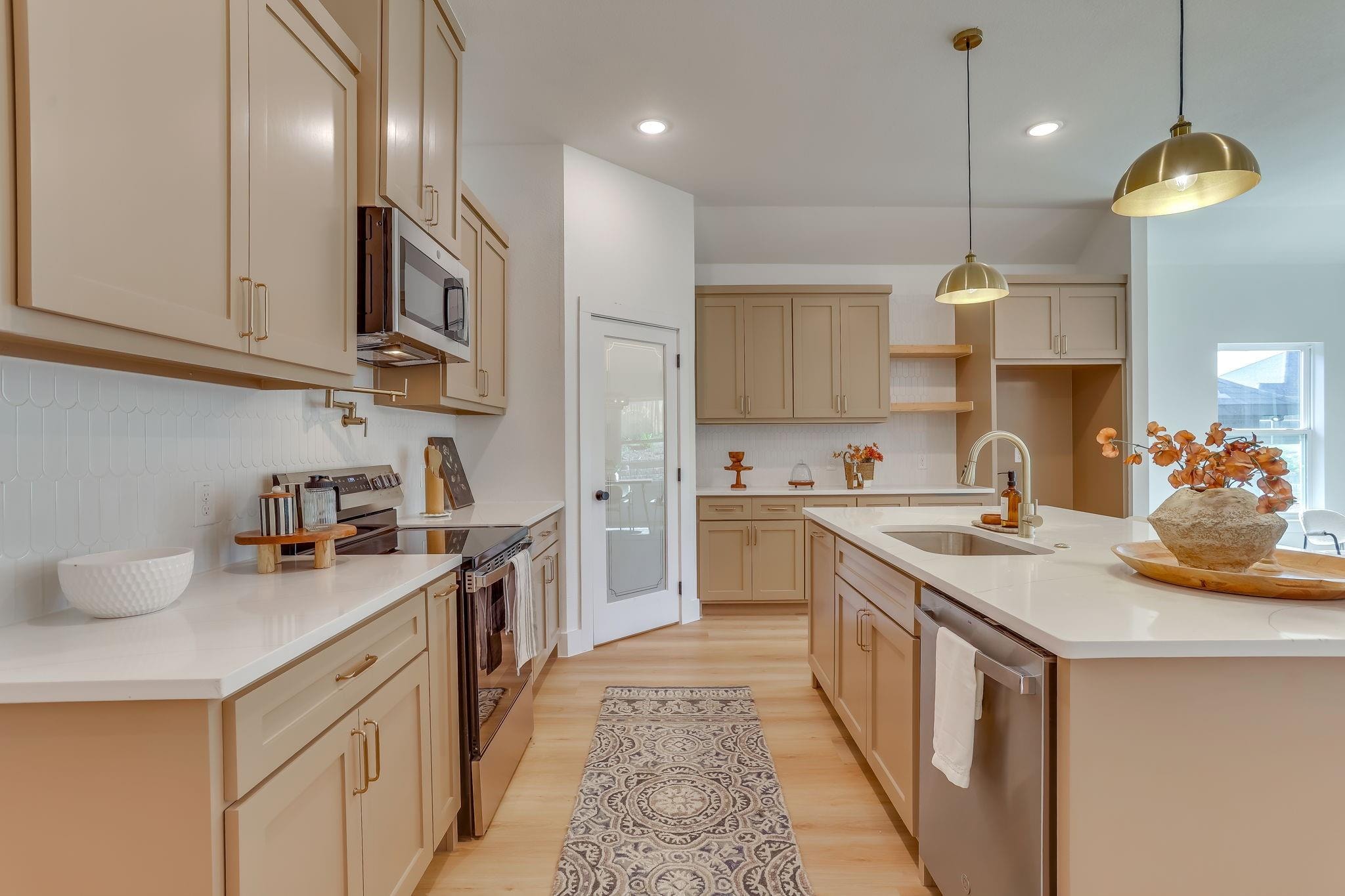 Humbert Residence — kitchen detail with brass fixtures